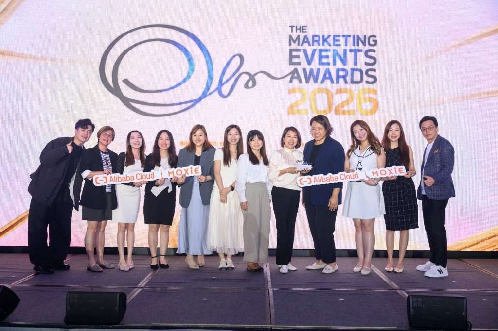 Moxie and Alibaba Cloud on stage at Marketing Events Awards 2026 with the trophy