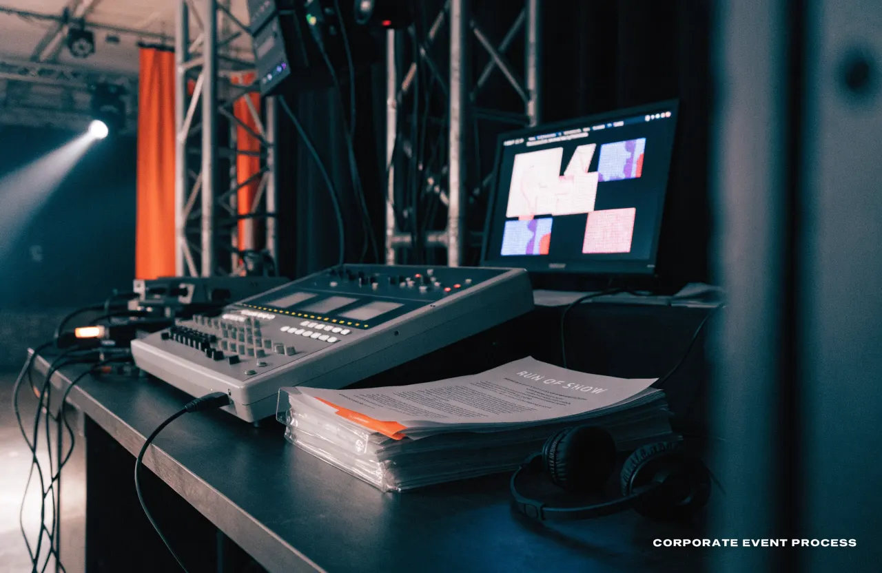 Event rehearsal desk with lighting console and run-of-show binder